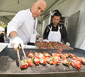 Skewers of meat and vegetables being grilled